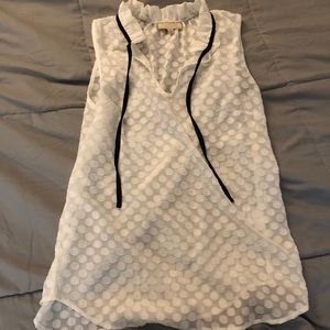 Sleeveless white blouse